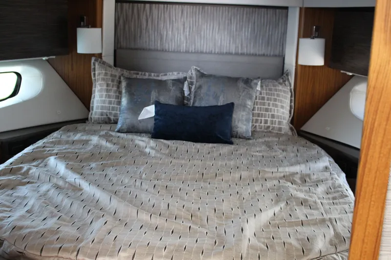 Slide: The Image of Luxurious bedroom interior of 2020 Tiara Yachts C49 Coupe with elegant bedding. - 44