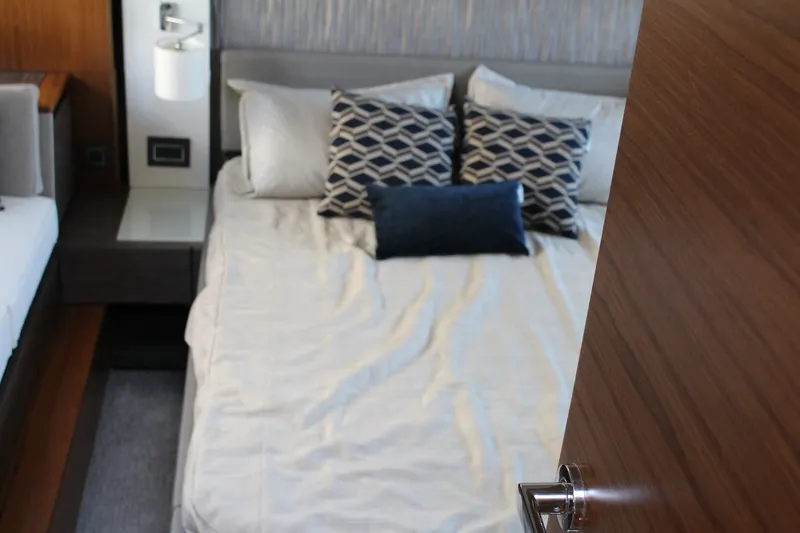 Slide: The Image of Luxurious bedroom interior of 2020 Tiara Yachts C49 Coupe with stylish bedding. - 46