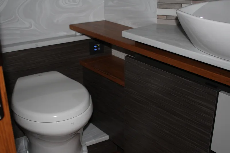 Slide: The Image of Luxury bathroom in 2020 Tiara Yachts C49 Coupe with modern fixtures and elegant design. - 48