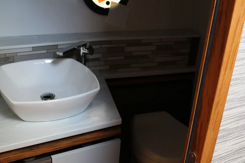 Slide: The Image of Modern bathroom interior of 2020 Tiara Yachts C49 Coupe with stylish sink and faucet. - 53