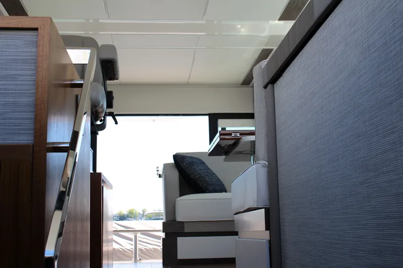 Slide: The Image of Interior of 2020 Tiara Yachts C49 Coupe, featuring modern seating and sleek design elements. - 58