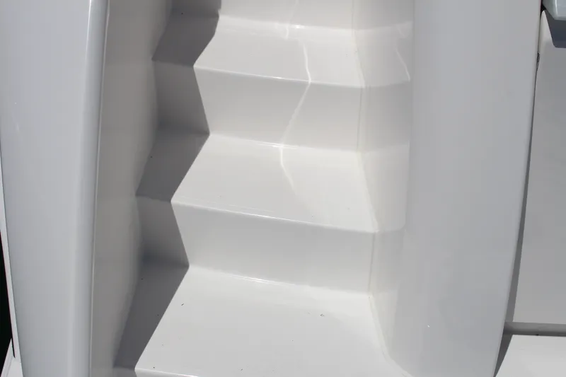 Slide: The Image of White steps on a 2020 Tiara Yachts C49 Coupe. - 6