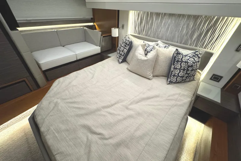 Slide: The Image of Luxurious bedroom interior of 2020 Tiara Yachts C49 Coupe with elegant bedding and seating. - 60