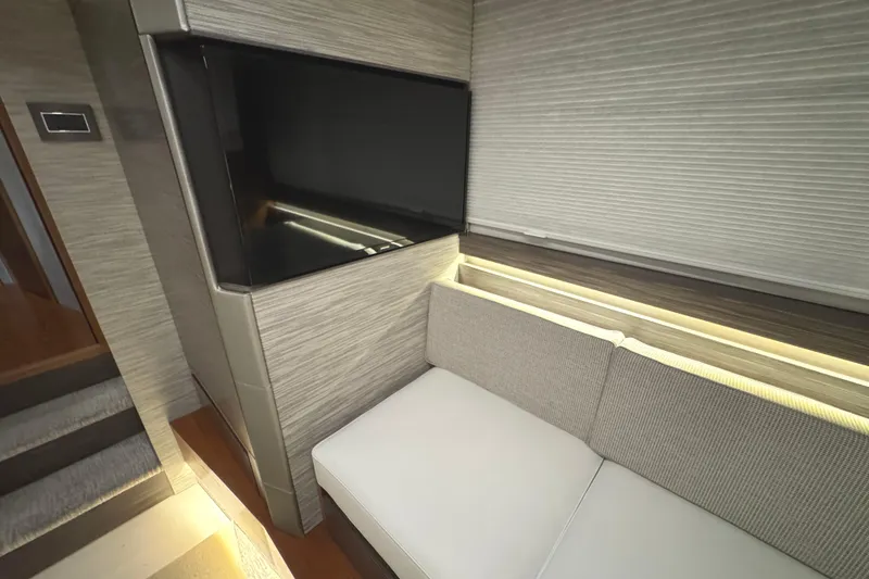 Slide: The Image of Luxurious interior of 2020 Tiara Yachts C49 Coupe with modern seating and ambient lighting. - 64