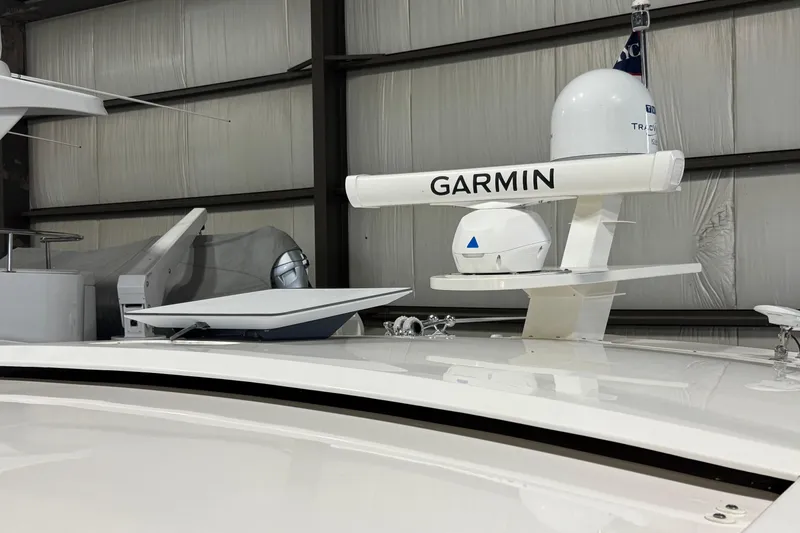 Slide: The Image of 2020 Tiara Yachts C49 Coupe with Garmin radar equipment in a storage facility. - 69