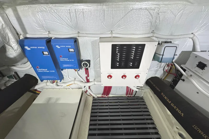 Slide: The Image of Engine room of 2020 Tiara Yachts C49 Coupe with Victron Energy chargers. - 75