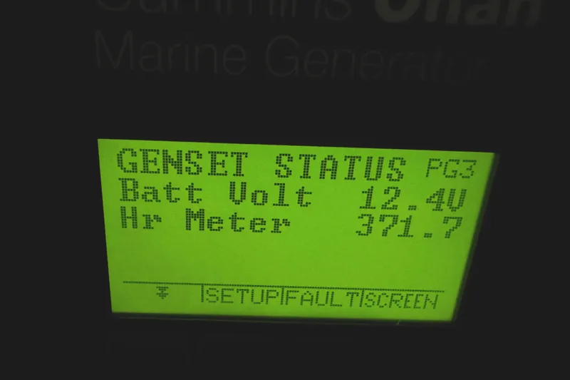 Slide: The Image of Display screen showing generator status with battery voltage and hour meter readings. - 76