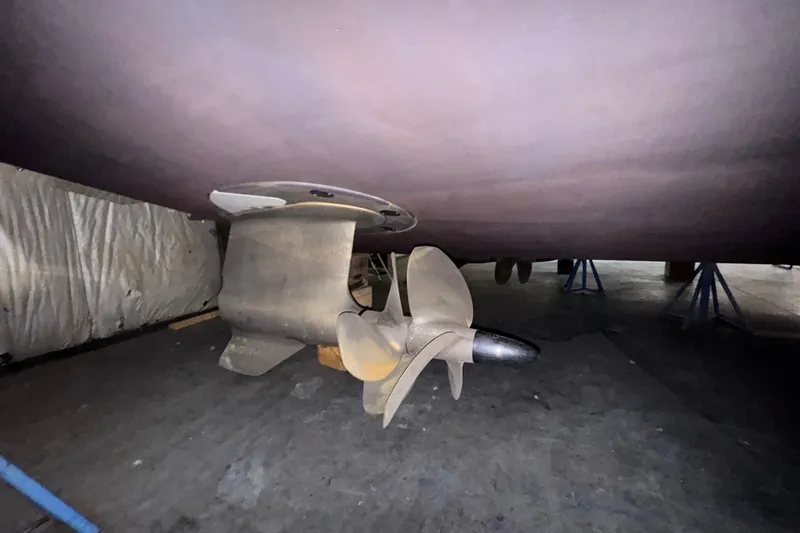 Slide: The Image of Underwater view of 2020 Tiara Yachts C49 Coupe propeller and rudder in dry dock. - 82