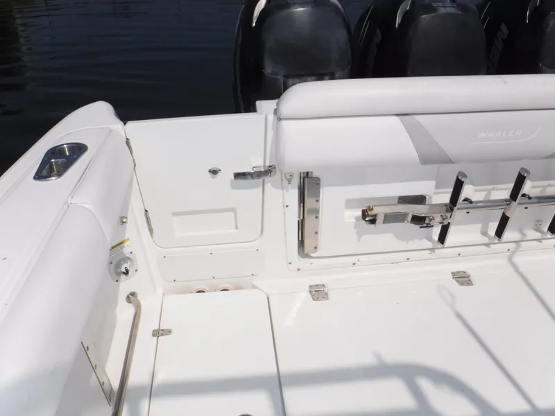 Slide: The Image of 2014 Boston Whaler 370 Outrage boat interior with seating and engine view. - 25