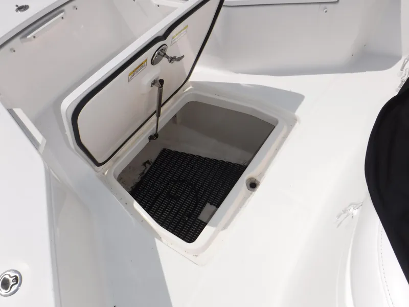 Slide: The Image of Open storage compartment on 2014 Boston Whaler 370 Outrage boat deck. - 28