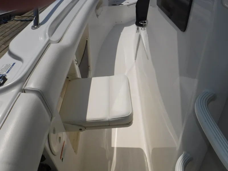 Slide: The Image of 2014 Boston Whaler 370 Outrage boat interior with white seating and sleek design. - 31