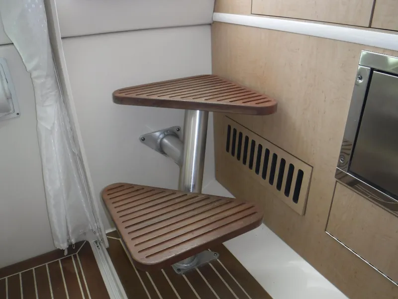 Slide: The Image of 2014 Boston Whaler 370 Outrage interior with wooden steps and modern design elements. - 41