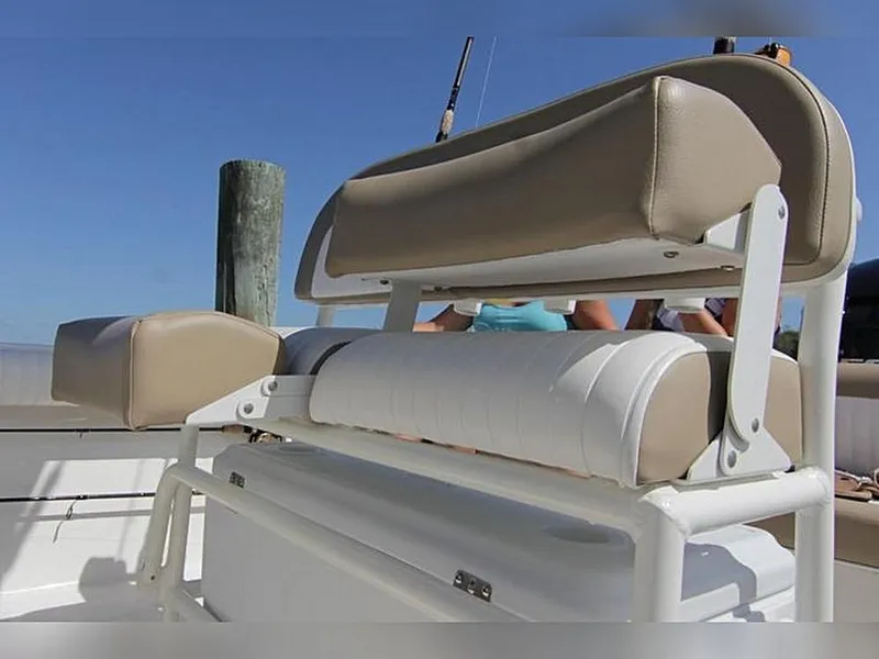 Slide: The Image of 2023 Sea Born LX22 Center Console boat seating with beige cushions. - 14