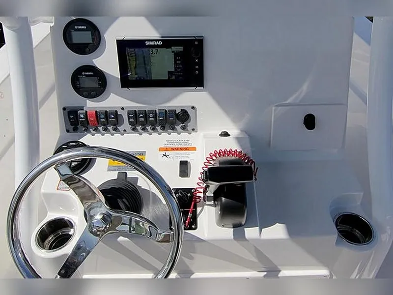 Slide: The Image of 2023 Sea Born LX22 Center Console dashboard with steering wheel and navigation controls. - 16