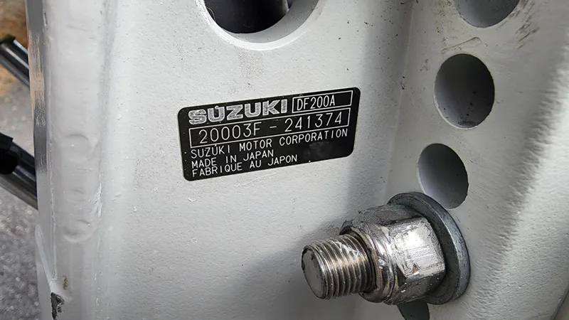 Slide: The Image of Suzuki DF200A engine label on a 2022 Sea Born LX22 Center Console boat. - 23