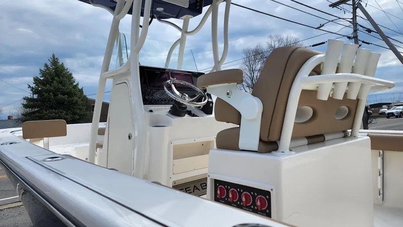Slide: The Image of 2022 Sea Born LX22 Center Console boat interior with helm and seating. - 7