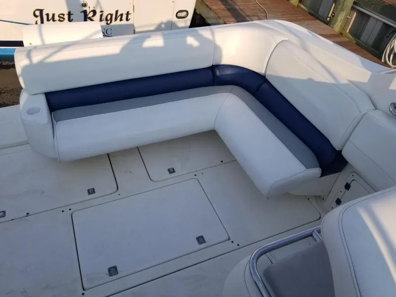 Slide: The Image of 1992 Baja 340 Motoryacht with white and blue seating on deck. - 15