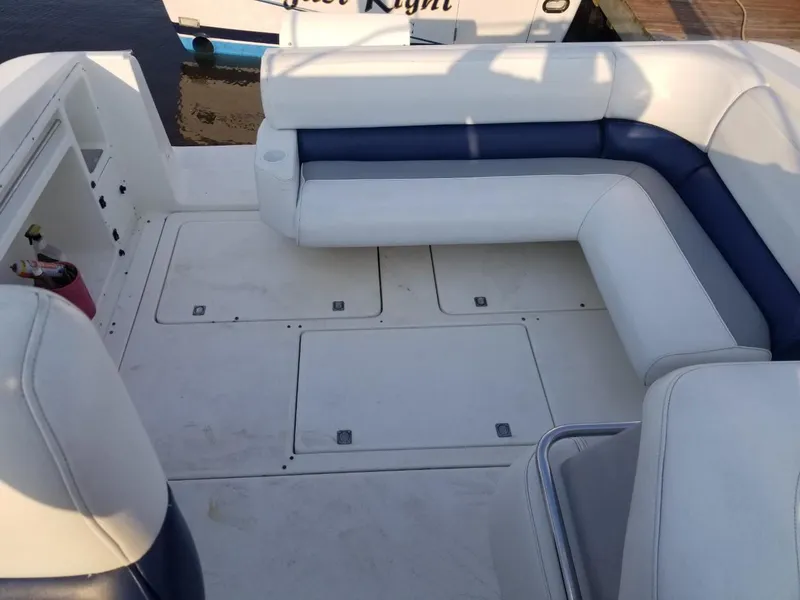 Slide: The Image of 1992 Baja 340 Motoryacht with white and blue seating on deck. - 19