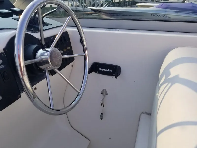 Slide: The Image of Steering wheel of a 1992 Baja 340 Motoryacht with Raymarine equipment. - 26
