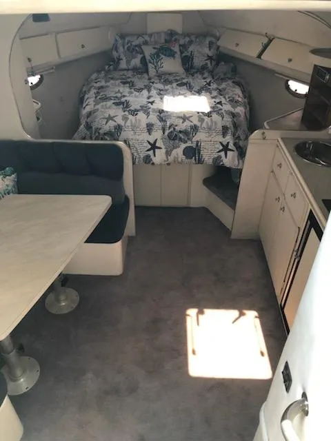 Slide: The Image of Interior of 1992 Baja 340 Motoryacht with bed, seating, and kitchenette. - 3