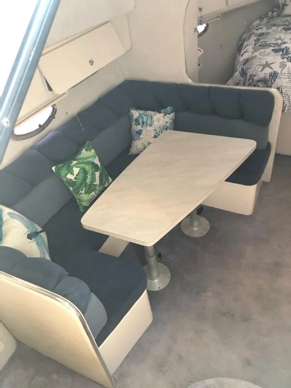Slide: The Image of Interior of 1992 Baja 340 Motoryacht with cozy dining area and plush seating. - 9