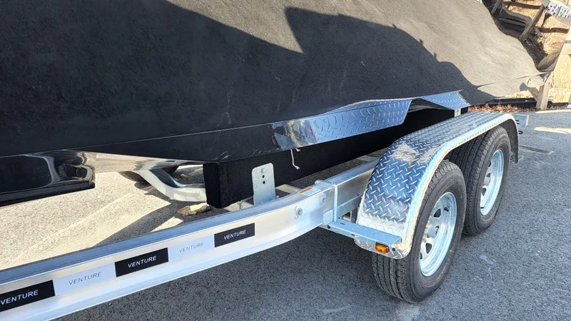 Slide: The Image of 2022 Sea Born LX24 Center Console boat on a Venture trailer. - 20