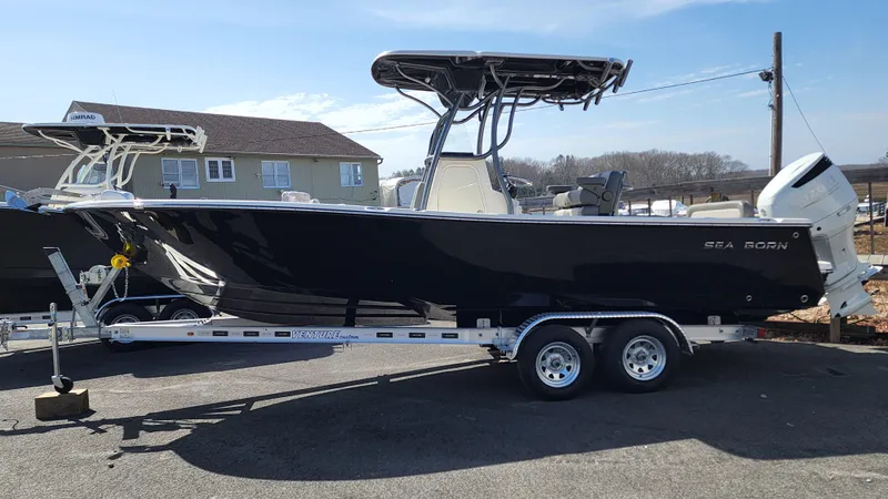 Slide: The Image of 2022 Sea Born LX24 Center Console boat on a trailer. - 3