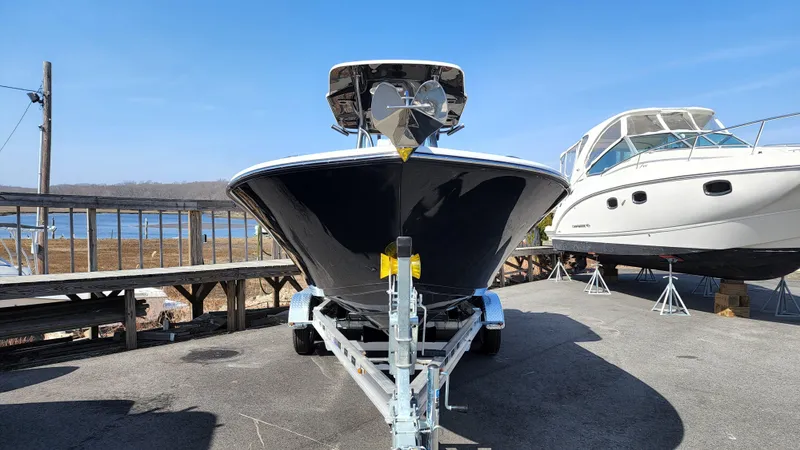 Slide: The Image of 2022 Sea Born LX24 Center Console boat on trailer, dockside view. - 4