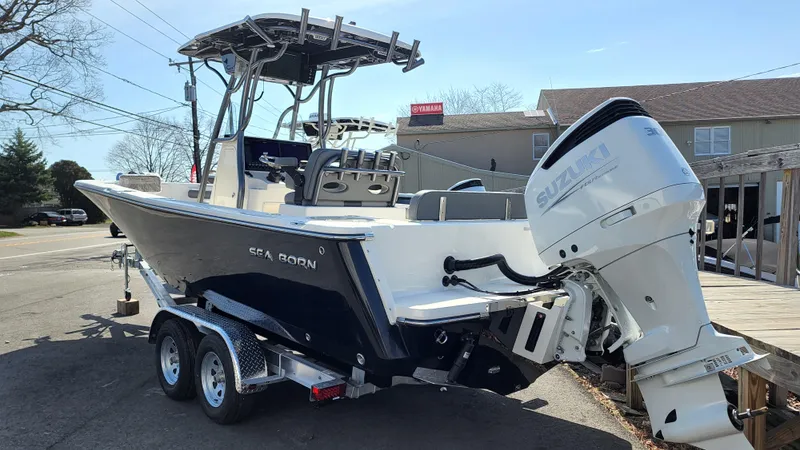 Slide: The Image of 2022 Sea Born LX24 Center Console boat on a trailer. - 5