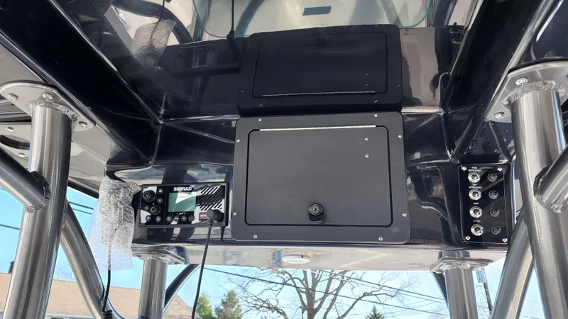 Slide: The Image of 2022 Sea Born LX24 Center Console boat electronics and storage compartments. - 7