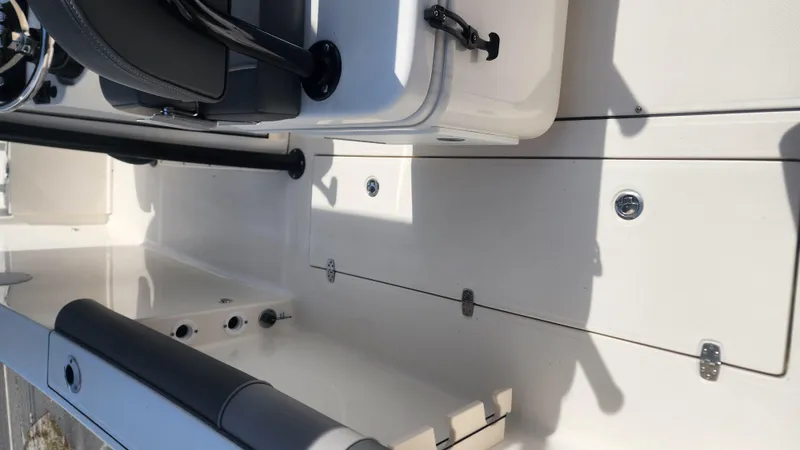 Slide: The Image of 2023 Sea Born SX239 Offshore boat interior with seating and storage compartments. - 24
