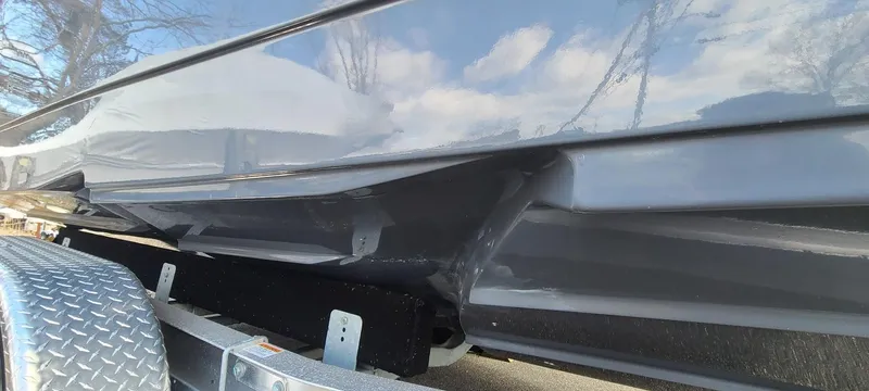 Slide: The Image of 2023 Sea Born SX239 Offshore boat hull on trailer. - 3