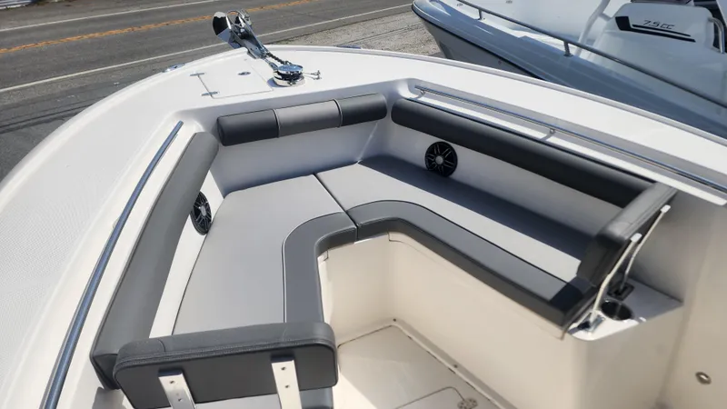 Slide: The Image of 2023 Sea Born SX239 Offshore boat with cushioned seating and speakers. - 31