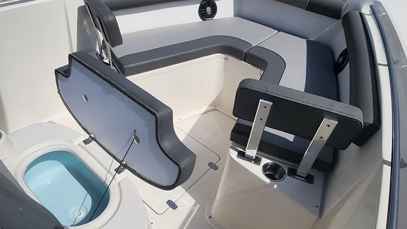 Slide: The Image of 2023 Sea Born SX239 Offshore boat interior with seating and storage compartments. - 35