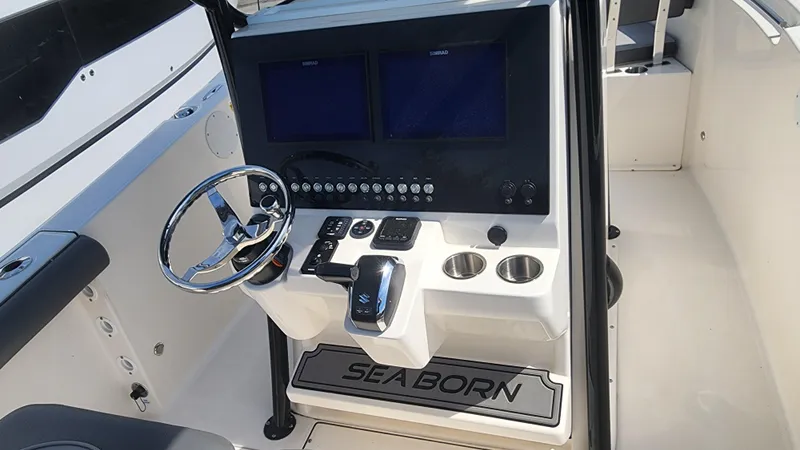 Slide: The Image of 2023 Sea Born SX239 Offshore boat console with dual screens and steering wheel. - 37
