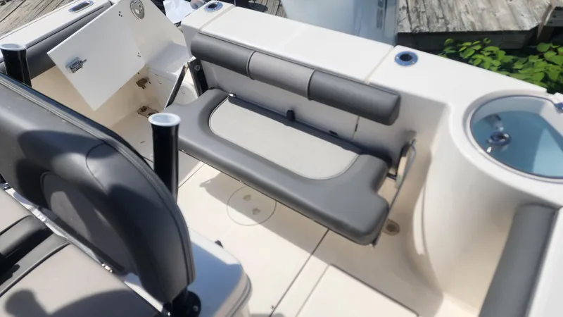 Slide: The Image of 2023 Sea Born SX239 Offshore boat interior with seating and storage compartments. - 42