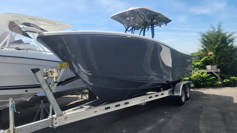 Slide: The Image of 2023 Sea Born SX239 Offshore boat on a trailer, ready for transport. - 44