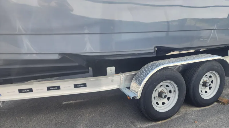 Slide: The Image of 2023 Sea Born SX239 Offshore boat on a dual-axle trailer. - 45