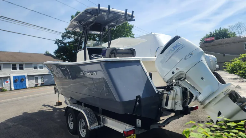 Slide: The Image of 2023 Sea Born SX239 Offshore boat on a trailer with a powerful outboard motor. - 46
