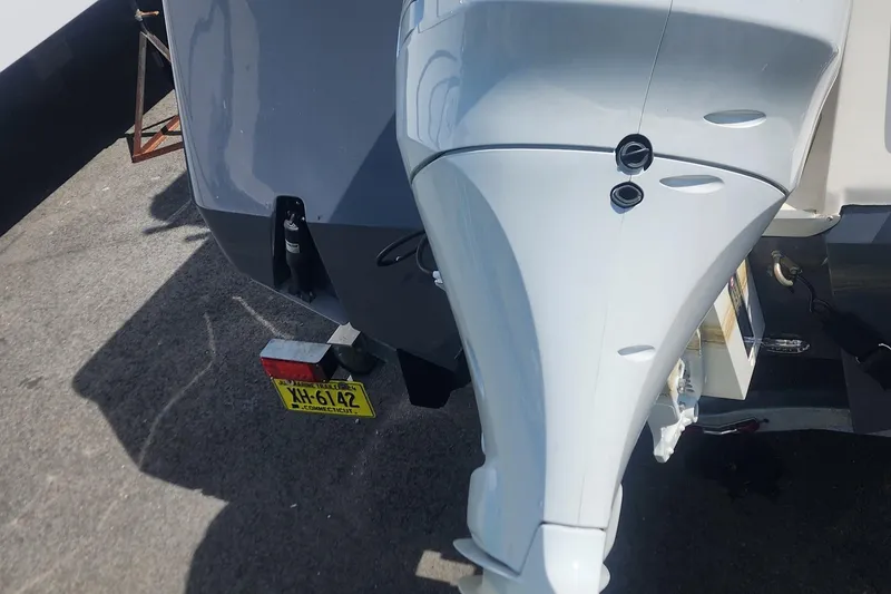 Slide: The Image of 2023 Sea Born SX239 Offshore boat with outboard motor and license plate. - 48