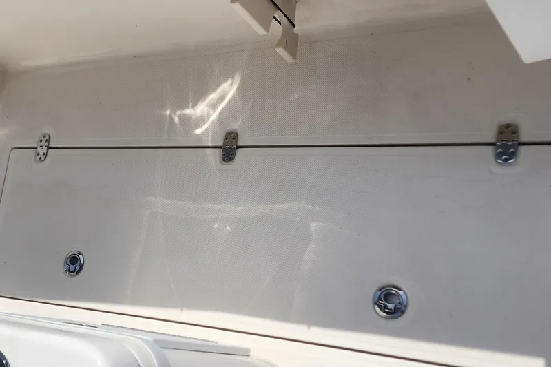 Slide: The Image of 2023 Sea Born SX239 Offshore storage compartment with secure latches and clean design. - 49