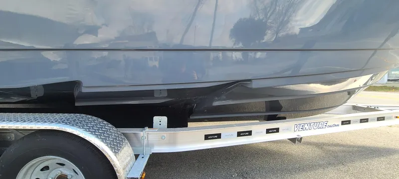 Slide: The Image of 2023 Sea Born SX239 Offshore boat on a trailer, side view. - 5