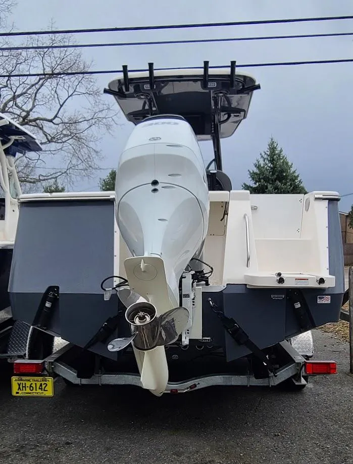 Slide: The Image of 2023 Sea Born SX239 Offshore boat rear view with outboard motor. - 7