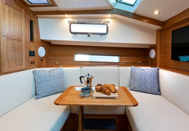Slide: The Image of Interior of 2025 Sabre 43 Salon Express yacht with cozy dining area. - 26