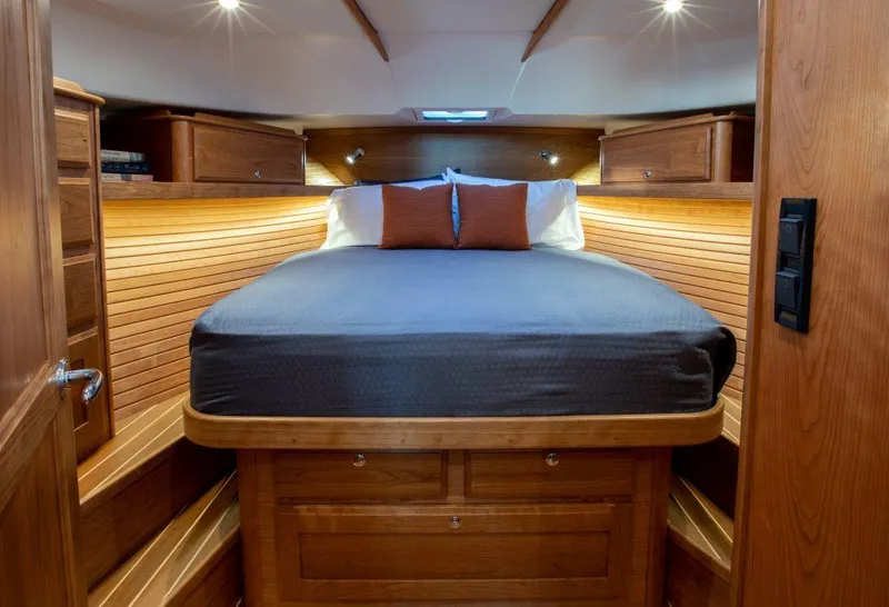 Slide: The Image of Luxurious bedroom interior of 2025 Sabre 43 Salon Express yacht with wooden finishes. - 28