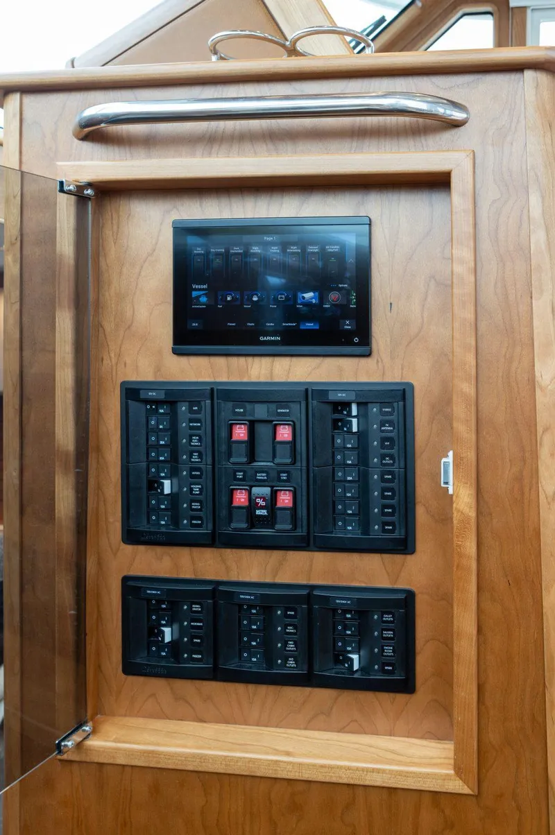 Slide: The Image of Control panel of 2025 Sabre 43 Salon Express yacht with touchscreen and switches. - 36