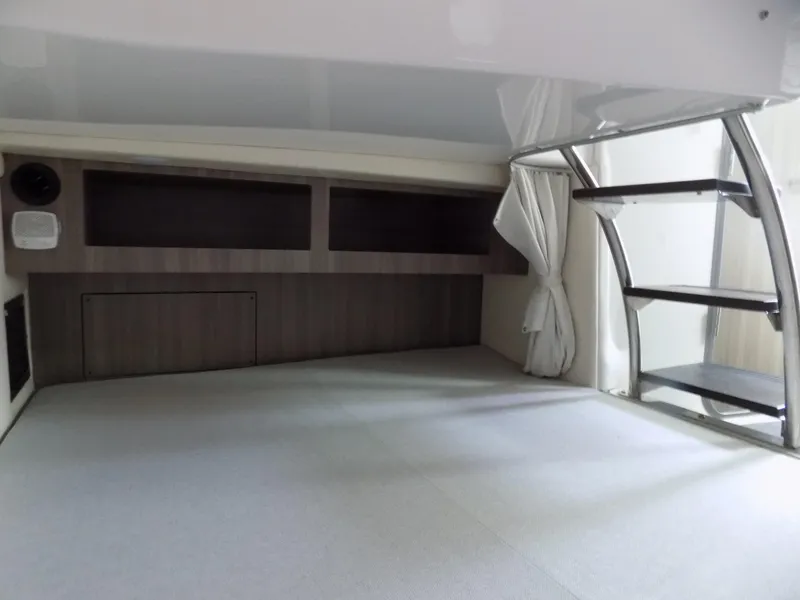 Slide: The Image of Interior cabin of 2019 Regal 28 Express boat with modern design and shelving. - 12