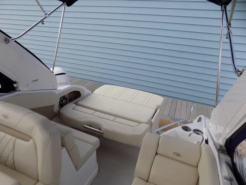 Slide: The Image of 2019 Regal 28 Express boat interior with beige seating and modern design. - 8