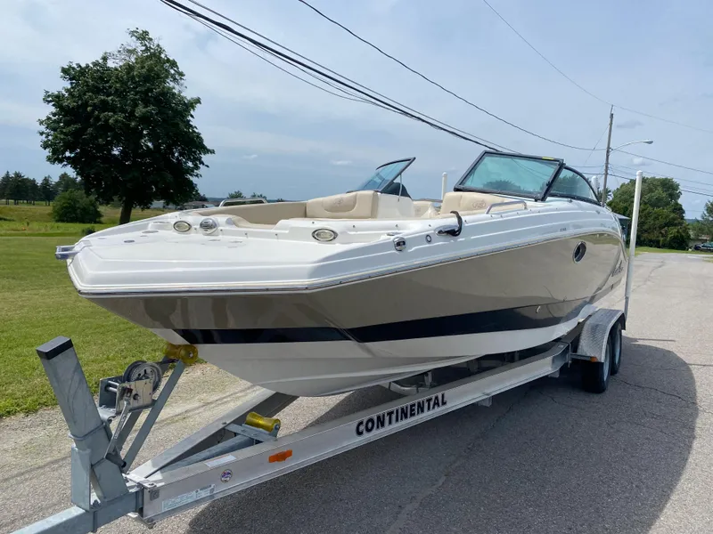 The Image of 2018 NauticStar 243DC Sport Deck boat on Continental trailer. - 0