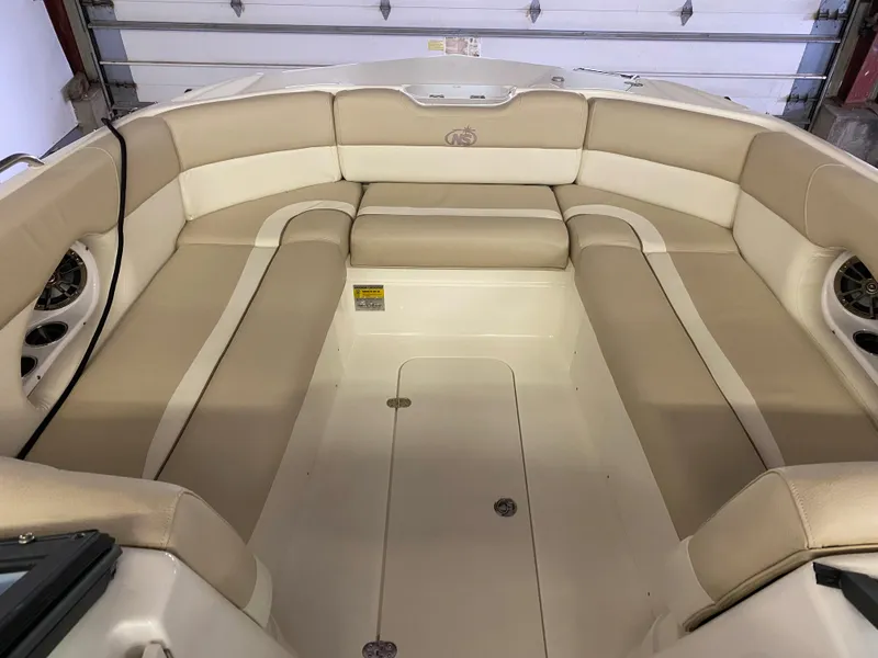 Slide: The Image of 2018 NauticStar 243DC Sport Deck boat interior with beige seating. - 14
